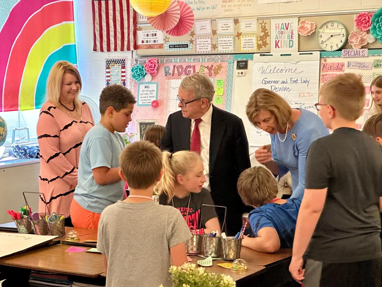 Governor Mike DeWine talks to students at Heath's Stevenson Elementary last Wednesday, as he watched the literacy program based on the Science of Reading in action.