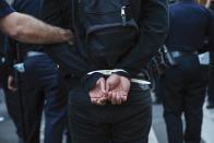 New York Police Department officers detain a protester during a march through the Manhattan borough of New York City calling for social, economic, and racial justice April 29, 2015. Billed as "NYC Rise Up & Shut it Down With Baltimore", the demonstration was being held to support Baltimore's protests against police brutality following the April 19 death of Freddie Gray in police custody. (REUTERS/Lucas Jackson)