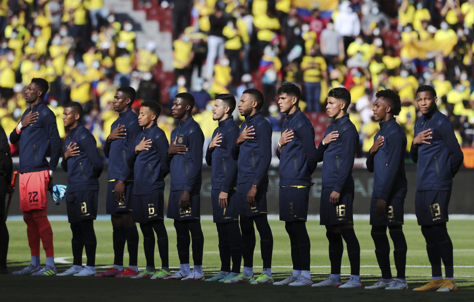 FILE - Ecuador players sing their national anthem prior to a FIFA World Cup Qatar 2022 qualifying soccer match at Rodrigo Paz Delgado stadium in Quito, Ecuador, Nov. 11, 2021. Ecuador summoned 28 players on Saturday, Jan. 22, 2022, for the crucial double round of qualifiers in which they will host Brazil, and visit Peru. (Jose Jacome/AP File)