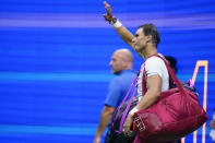 Rafael Nadal, of Spain, waves to fans after his loss to Frances Tiafoe, of the United States, during the fourth round of the U.S. Open tennis championships, Monday, Sept. 5, 2022, in New York. (AP Photo/Julia Nikhinson)