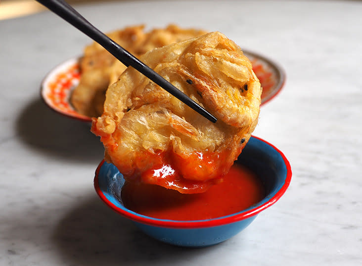 Dip your crunchy prawn fritters or 'har jii' with their mild tasting chilli sauce.