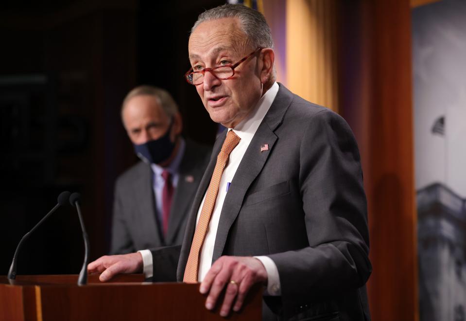 Senate Minority Leader Chuck Schumer, D-N.Y., speaks during a press conference at the U.S. Capitol with Sen. Tom Carper, D-Del., on Dec. 8, 2020.