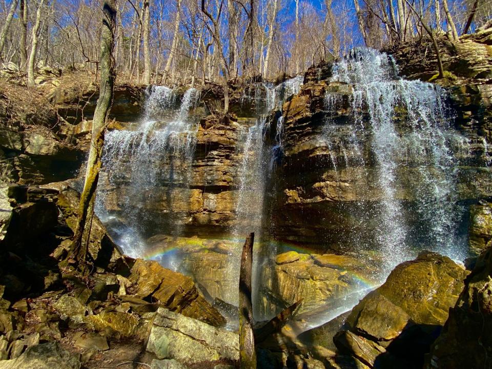 A spectacular waterfall plunges to a cave below it in Bethel Spring Nature Preserve, New Hope, Alabama.