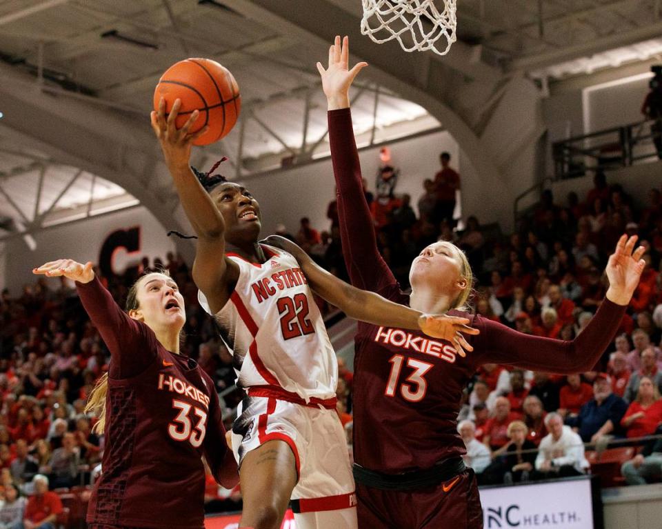 N.C. State’s Saniya Rivers drives to the basket past Virginia Tech’s Elizabeth Kitley and Clara Strack during the second half of the Wolfpack’s 72-61 loss on Thursday, Feb. 8, 2024, at Reynolds Coliseum in Raleigh, N.C.