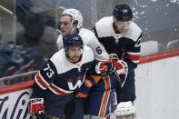 New York Islanders defenseman Ryan Pulock (6) collides with Washington Capitals left wing Conor Sheary (73) and center Lars Eller (20) during the first period of an NHL hockey game Tuesday, Jan. 26, 2021, in Washington. (AP Photo/Nick Wass)