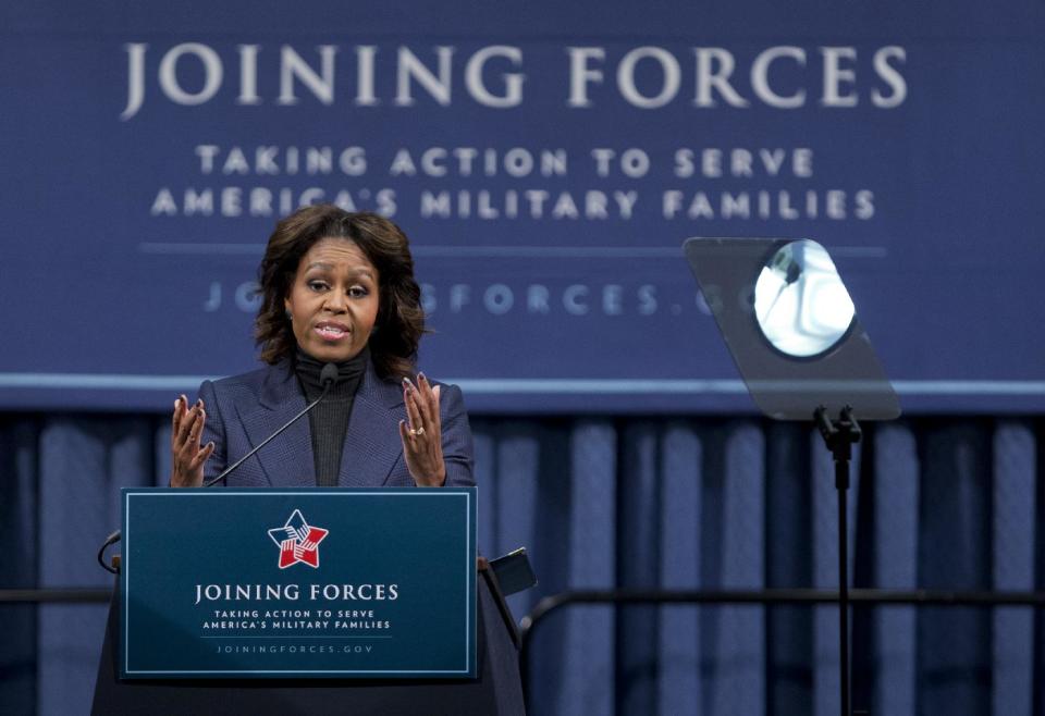 First lady Michelle Obama speaks at a National Symposium on Veterans’ Employment in Construction, hosted by the Labor Department, Monday, Feb. 10, 2014, in Washington. Mrs. Obama said a construction industry pledge to hire 100,000 veterans by 2019 isn't only the right and patriotic thing to do, but also a smart thing for business. (AP Photo/Manuel Balce Ceneta)