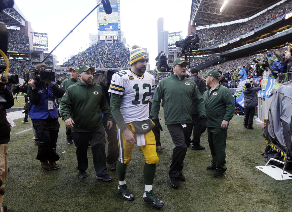 Aaron Rodgers walks off the field after an NFC championship game loss to the Seahawks in January 2015. (AP)