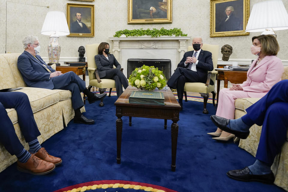 FILE - President Joe Biden speaks during a meeting with congressional leaders in the Oval Office of the White House in Washington, May 12, 2021. From left, House Minority Leader Kevin McCarthy of Calif., Senate Minority Leader Mitch McConnell of Ky., Vice President Kamala, Biden, House Speaker Nancy Pelosi of Calif., and Senate Majority Leader Chuck Schumer of N.Y. Biden, who served for 36 years in the Senate, is an institutionalist to his core and has tried to operate under the constraints of those institutions — unlike his predecessor who repeatedly pushed the boundaries of executive power. (AP Photo/Evan Vucci, File)