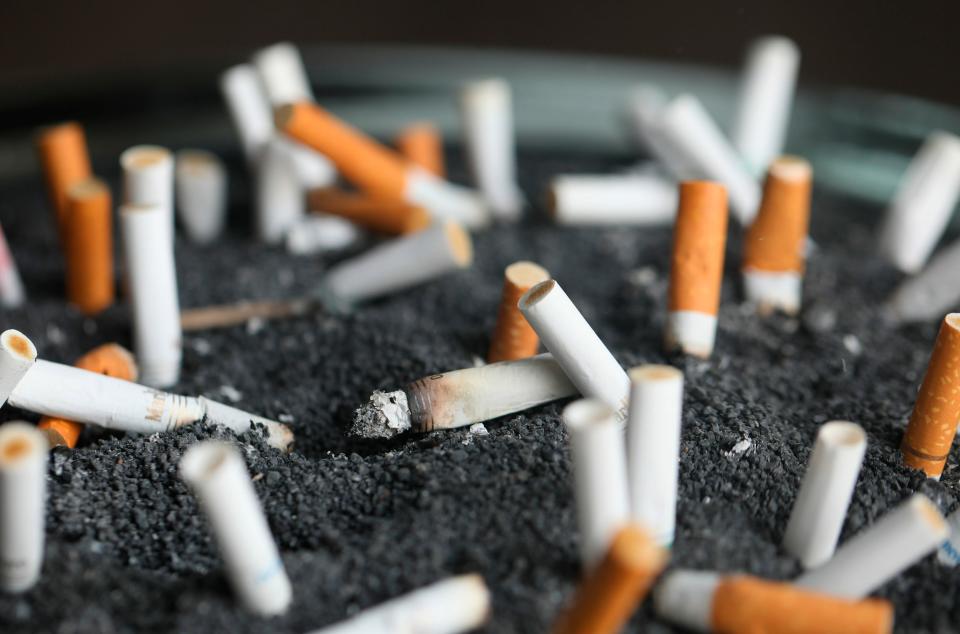 This March 28, 2019 photo shows cigarette butts in an ashtray in New York. On Wednesday, Jan. 8, 2020, researchers reported the largest-ever decline in the U.S. cancer death rate, and they are crediting advances in the treatment of lung tumors. Most lung cancer cases are tied to smoking, and decades of declining smoking rates means lower rates of lung cancer diagnoses and deaths.