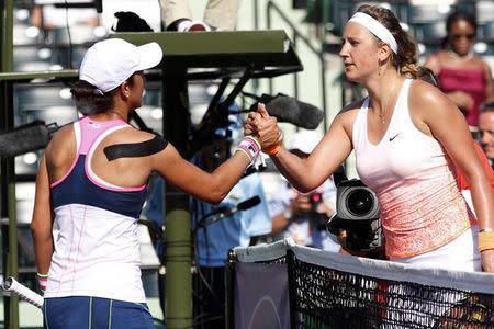 Mar 25, 2015; Key Biscayne, FL, USA; Victoria Azarenka (right) shakes hands with Silvia Soler-Espinosa (left) after their match on day two of the Miami Open at Crandon Park Tennis Center. Azarenka won 6-1, 6-3. Mandatory Credit: Geoff Burke-USA TODAY Sports