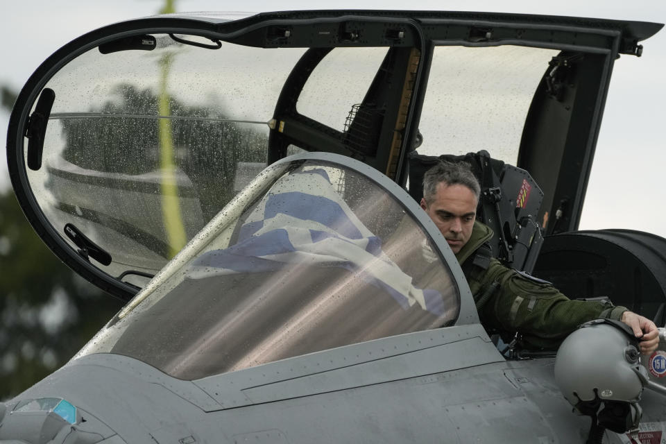 A Greek airforce pilot is seen inside a Rafale jets during a hand over ceremony in Tanagra military air base, about 82 kilometres (51miles) north of Athens, Greece, on Wednesday, Jan. 19, 2021. Six advanced-tech Rafale jets bought from the French air force were handed over Wednesday to the Greek armed forces ‒ the first major delivery to result from multi-billion euro defense deals sealed with Paris last year. (AP Photo/Thanassis Stavrakis)