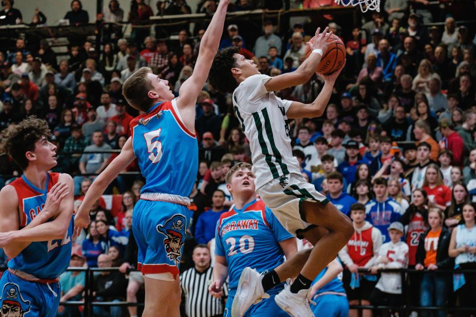 Malvern's Rodney Smith scores against Garaway during the Division III district final a year ago.