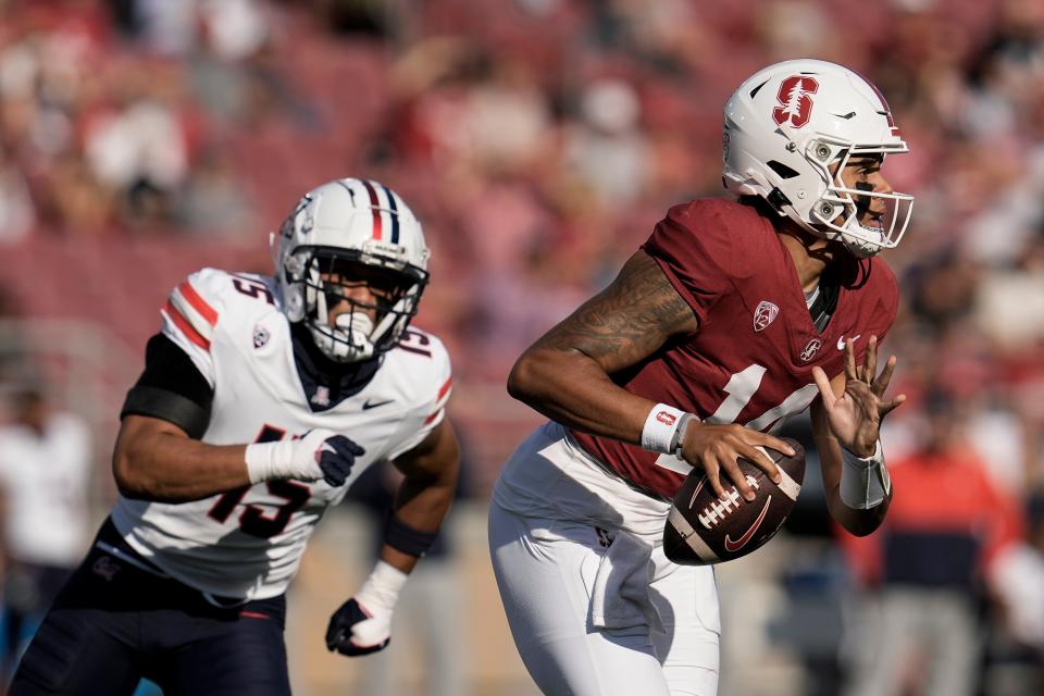 Stanford quarterback Ashton Daniels, right, looks for a receiver during the first half of the team's NCAA college football game against Arizona on Saturday, Sept. 23, 2023, in Stanford, Calif. (AP Photo/Godofredo A. Vásquez)