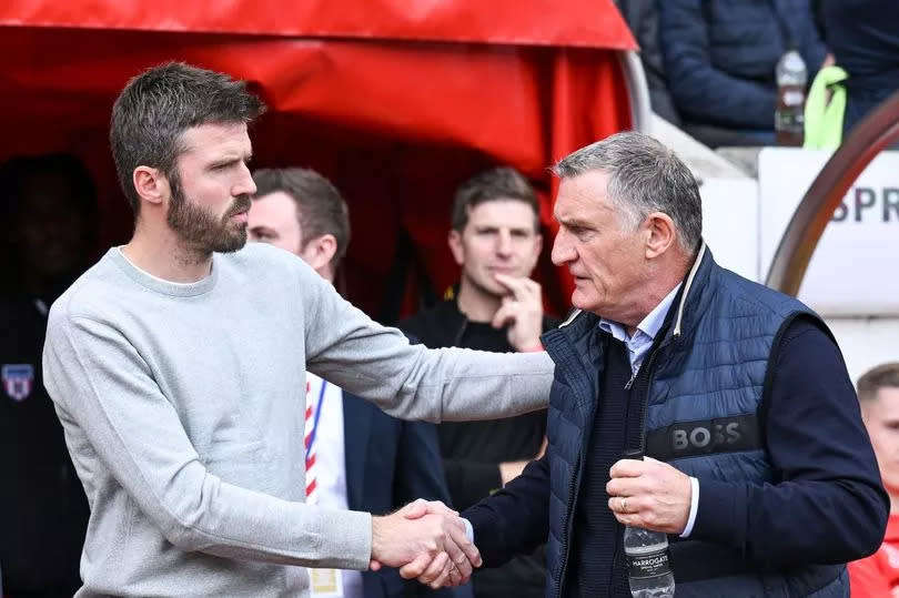 Michael Carrick, head coach of Middlesbrough, shakes hands with Tony Mowbray, manager of Sunderland