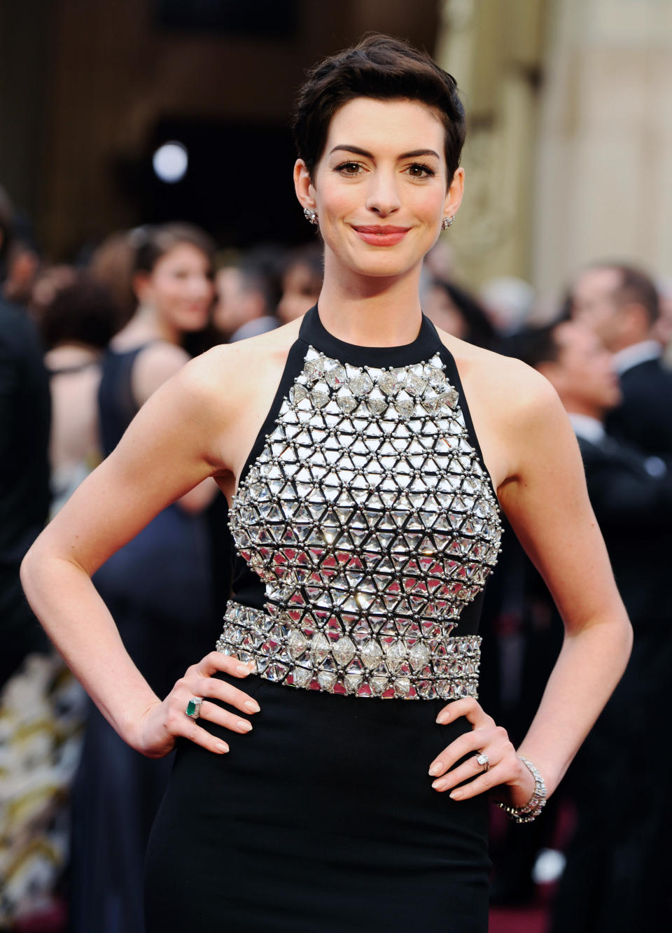 Anne Hathaway arrives at the Oscars on Sunday, March 2, 2014, at the Dolby Theatre in Los Angeles. (Photo by Chris Pizzello/Invision/AP)