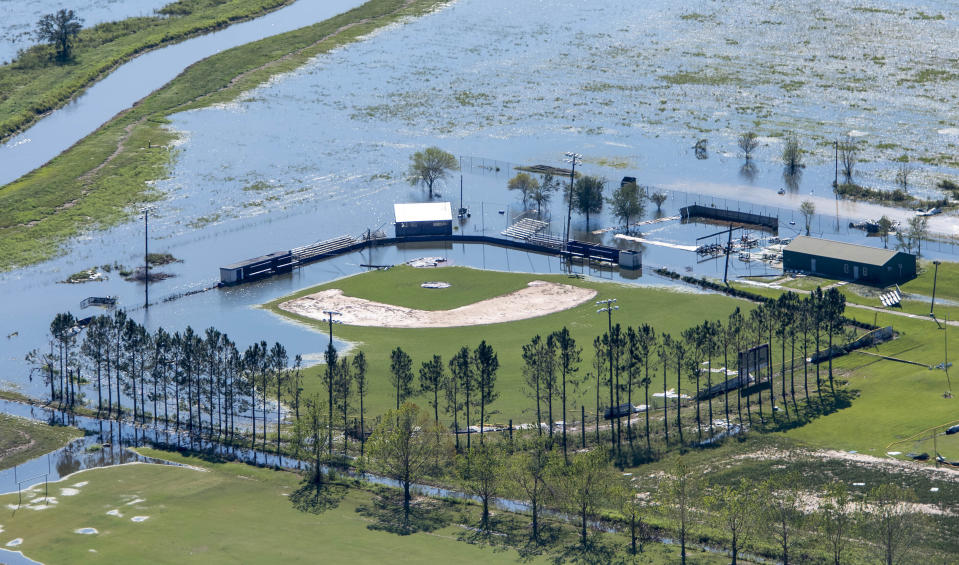 FILE - In this Oct. 10, 2020 file photo, a flooded recreational area is seen in the aftermath of Hurricane Delta in Iowa, La. Hurricane Delta, which made landfall about 11 miles from where the devastating Hurricane Laura hit a little more than a month earlier, cost $2.9 billion in the United States and was linked to six deaths in the U.S. and Mexico, according to a report from the National Hurricane Center. (Bill Feig/The Advocate via AP, Pool, File)