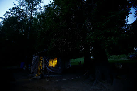 A hut of Tamara and Yuri Baikov, both 69, is seen at their small farm situated in a forest near the village of Yukhovichi, Belarus, May 24, 2018. REUTERS/Vasily Fedosenko