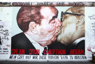 <p>In honour of the 30th anniversary of the German Democratic Republic in 1979, Soviet leader Leonid Brezhnev and East German President Erich Honecker famously shared a “fraternal kiss”. There was a Dmitri Vrubel murial of this moment on the Berlin Wall (shown here). <i>[Photo: Rex]</i><br></p>