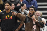 Utah Jazz guard Donovan Mitchell, right, shouts from the bench in the second half during an NBA basketball game against the Phoenix Suns Wednesday, Jan. 26, 2022, in Salt Lake City. (AP Photo/Rick Bowmer)