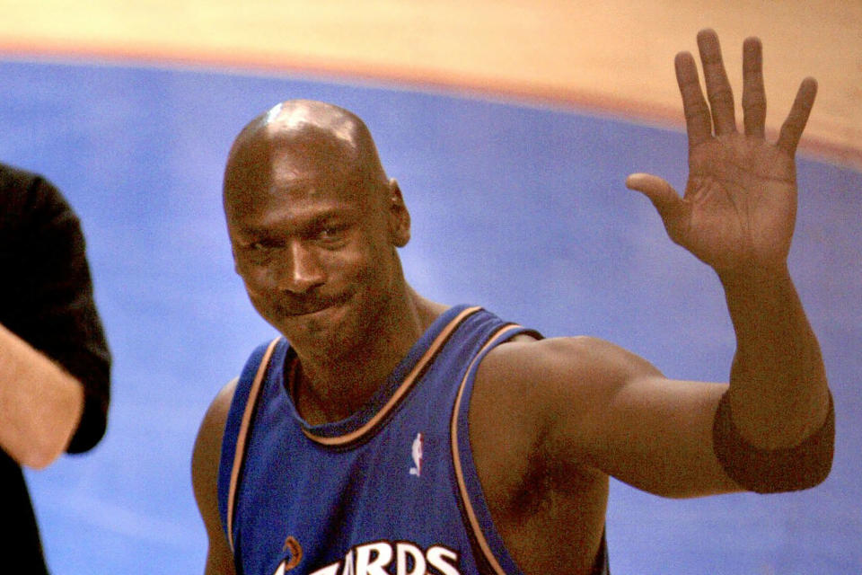 FILE - Washington Wizards' Michael Jordan waves as he walks off the court at the end of an NBA basketball game against the Philadelphia 76ers on April 16, 2003, in Philadelphia. It was Jordan's last NBA game. (AP Photo/Miles Kennedy, File)