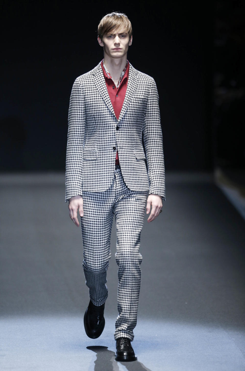 A model wears a creation for Gucci men's Fall-Winter 2013-14 collection, part of the Milan Fashion Week, unveiled in Milan, Italy, Monday, Jan. 14, 2013. (AP Photo/Antonio Calanni)