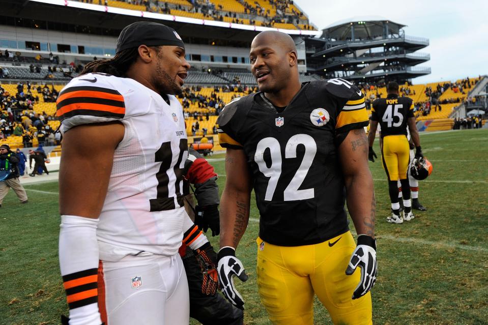 Cleveland Browns wide receiver Josh Cribbs (16) talks with Pittsburgh Steelers outside linebacker James Harrison (92) after the teams' game Dec. 30, 2012, in Pittsburgh.