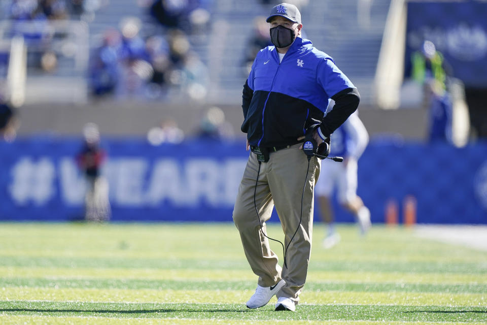 Kentucky head coach Mark Stoops walks on the field during the first half before an NCAA college football game against Georgia, Oct. 31, 2020, in Lexington, Ky. (AP Photo/Bryan Woolston)