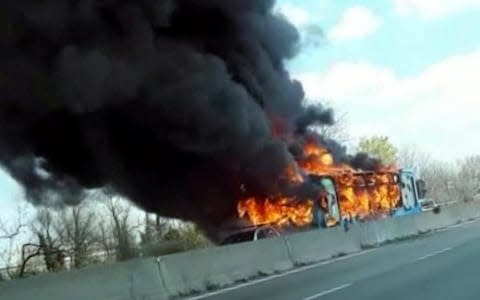 The bus was set alight by its driver in protest at the deaths of migrants in the Mediterranean, police said - Credit: Facebook