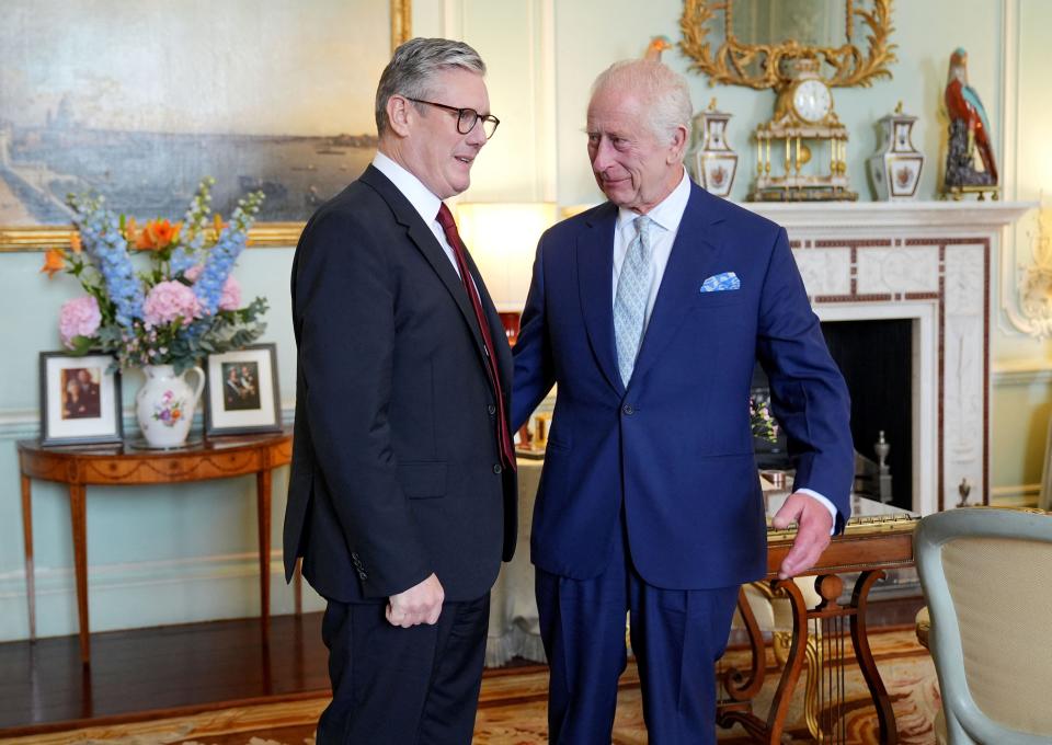 King Charles speaks with Keir Starmer during an audience at Buckingham Palace.