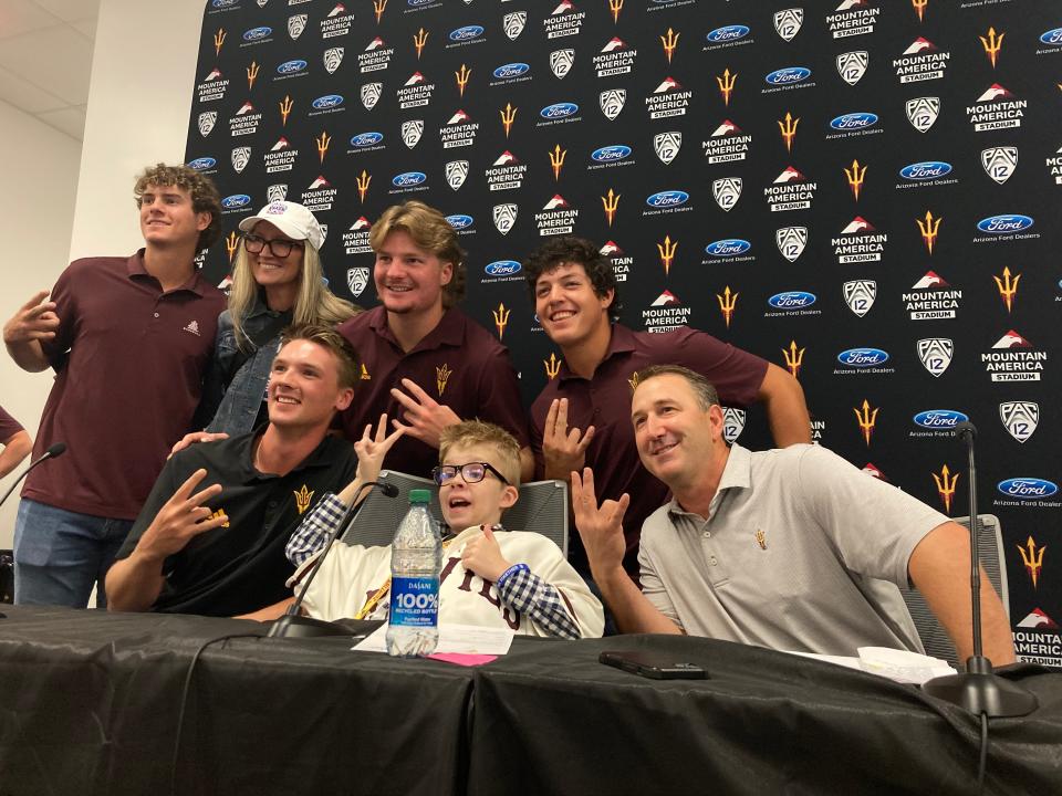 Thad Earle, center, poses with his new Arizona State baseball teammates and head coach Willie Bloomquist, bottom right, after signing his Letter of Intent on Monday at Mountain America Stadium.