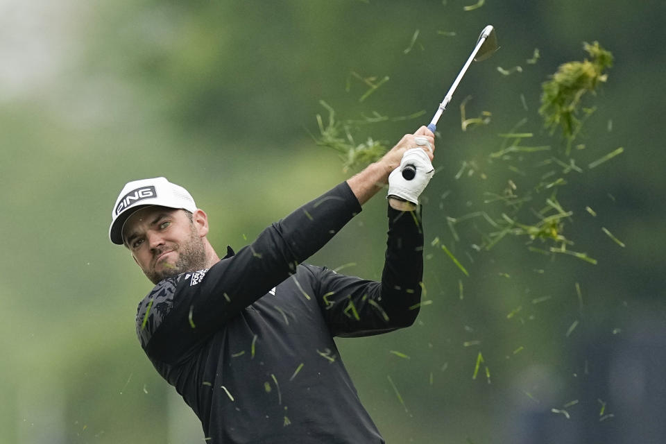Corey Conners, of Canada, hits from the rough on the 16th hole during the third round of the PGA Championship golf tournament at Oak Hill Country Club on Saturday, May 20, 2023, in Pittsford, N.Y. (AP Photo/Eric Gay)