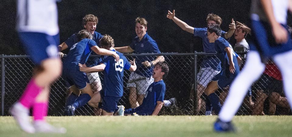Montgomery Academy John Allen Lachney (29) celebrates his winning goal with teammates and fans during AHSAA Soccer playoff action at the MA campus in Montgomery, Ala., on Tuesday April 30, 2024.