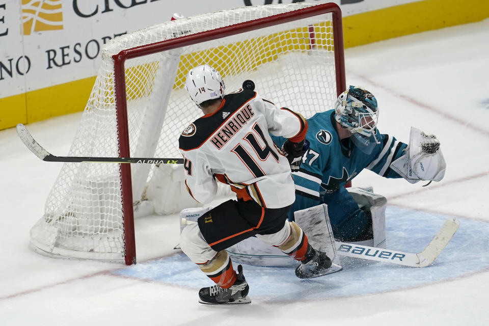 Anaheim Ducks center Adam Henrique (14) scores a goal past San Jose Sharks goaltender James Reimer during the shootout in an NHL hockey game in San Jose, Calif., Saturday, Nov. 5, 2022. The Ducks won 5-4. (AP Photo/Jeff Chiu)