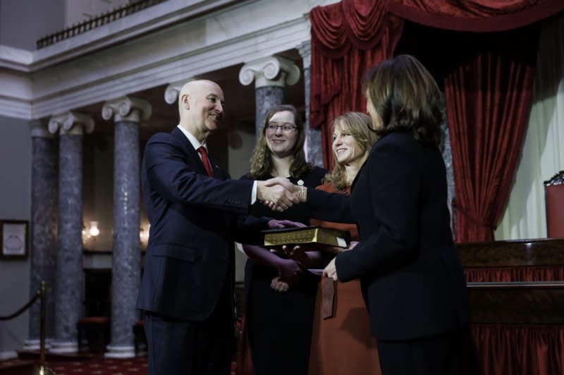 U.S. Vice President Kamala Harris shakes hands with Sen. Pete Ricketts, R-Neb., after she ceremonially administered the oath of office in the Old Senate Chamber at the U.S. Capitol in January 2023. File Photo by Ting Shen/UPI