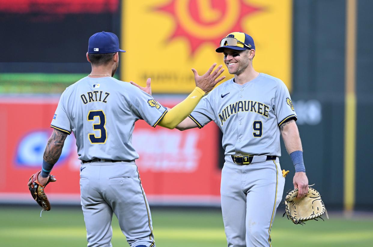 BALTIMORE, MARYLAND - APRIL 13: Jake Bauers #9 and Joey Ortiz #3 of the Milwaukee Brewers celebrate after a 11-5 victory against the Baltimore Orioles at Oriole Park at Camden Yards on April 13, 2024 in Baltimore, Maryland. (Photo by Greg Fiume/Getty Images)