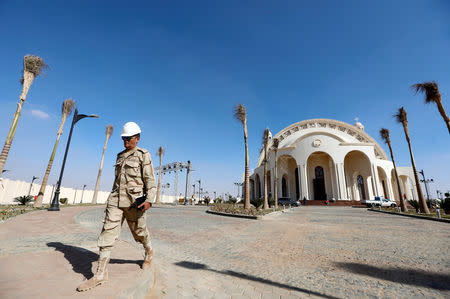 A member of Egyptian Army walks outside the new Coptic Cathedral "The Nativity of Christ" before Sunday's Coptic Christmas Eve Mass in the New Administrative Capital (NAC) east of Cairo, Egypt January 3, 2019. Picture taken January 3, 2019. REUTERS/Amr Abdallah Dalsh