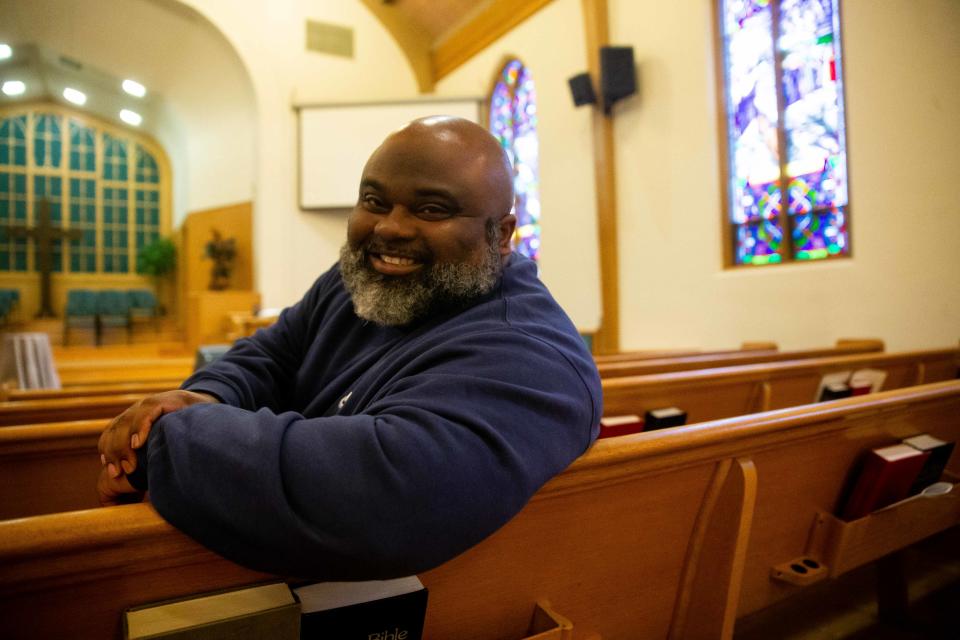 Maple Avenue Ministries Pastor Winfred Burns sits amongst the pews of his church Wednesday, Feb. 15, 2023.