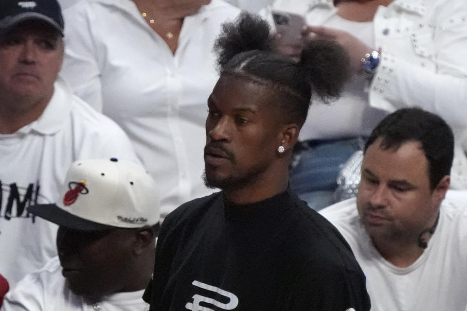 Miami Heat forward Jimmy Butler looks on from the bench during the first half of Game 3 of an NBA basketball first-round playoff series against the Boston Celtics, Saturday, April 27, 2024, in Miami. (AP Photo/Wilfredo Lee)