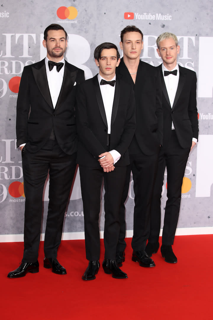 <p>Wearing tuxedos. <em>[Photo: Getty]</em> </p>