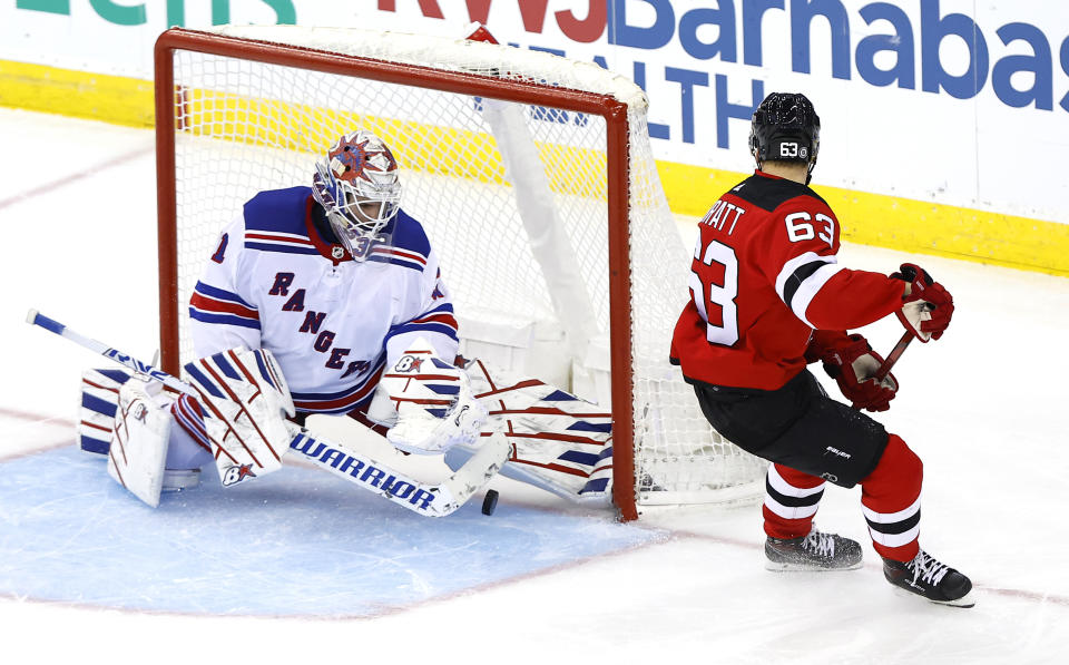 New York Rangers goaltender Igor Shesterkin makes a save against New Jersey Devils left wing Jesper Bratt (63) during the third period of an NHL hockey game Saturday, Nov. 18, 2023, in Newark, N.J. (AP Photo/Noah K. Murray)