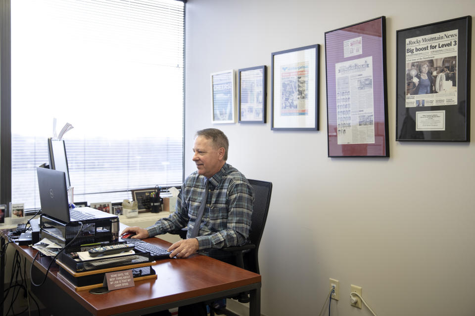 In this Tuesday, March 10, 2020 photo, Shane Fitzgerald Regional Executive Editor for Gannett works at his computer in Langhorne, Pa. (AP Photo/Matt Rourke)