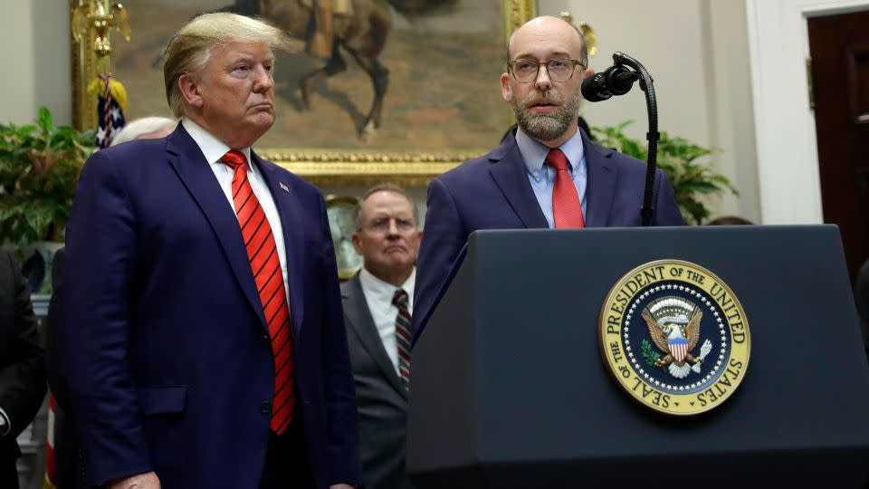 President Donald Trump listens as acting director of the Office of Management and Budget Russell Vought speaks during a White House event in October 2019. - Evan Vucci/AP