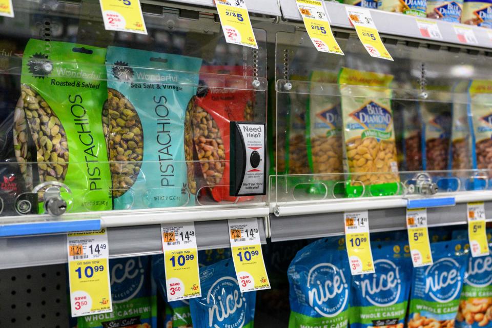 Food items locked to prevent shoplifting are seen at a Duane Reade pharmacy on August 24, 2023 in New York.