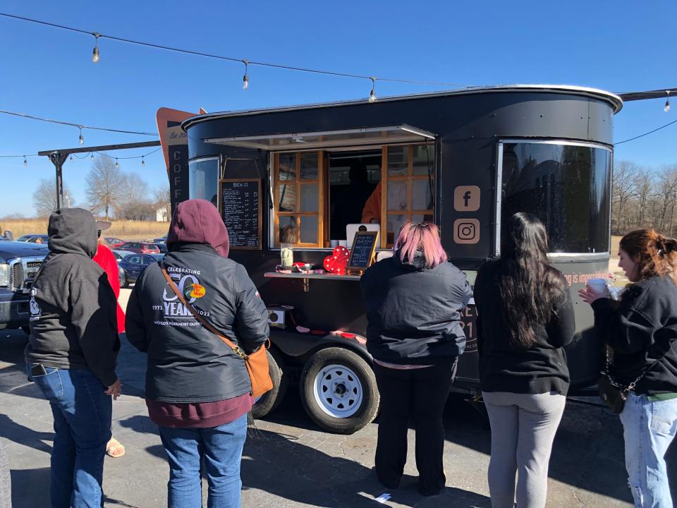 People wait in line for coffee from the Brew 21 Extra Chromosome Coffee Company truck at the 417 Tattoo Collaborative Flash Bash in Fair Grove on Jan. 20, 2023.