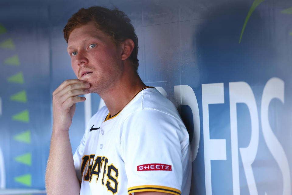 Pittsburgh Pirates Mitch Keller (23) look out from the dugout against the St. Louis Cardinals during a baseball game in Pittsburgh, Tuesday, July 2, 2024. (AP Photo/Jared Wickerham)