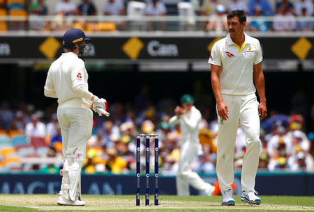 Cricket - Ashes test match - Australia v England - GABBA Ground, Brisbane, Australia, November 23, 2017. England's Mark Stoneman listens to Australia's Mitchell Starc during the first day of the first Ashes cricket test match. REUTERS/David Gray