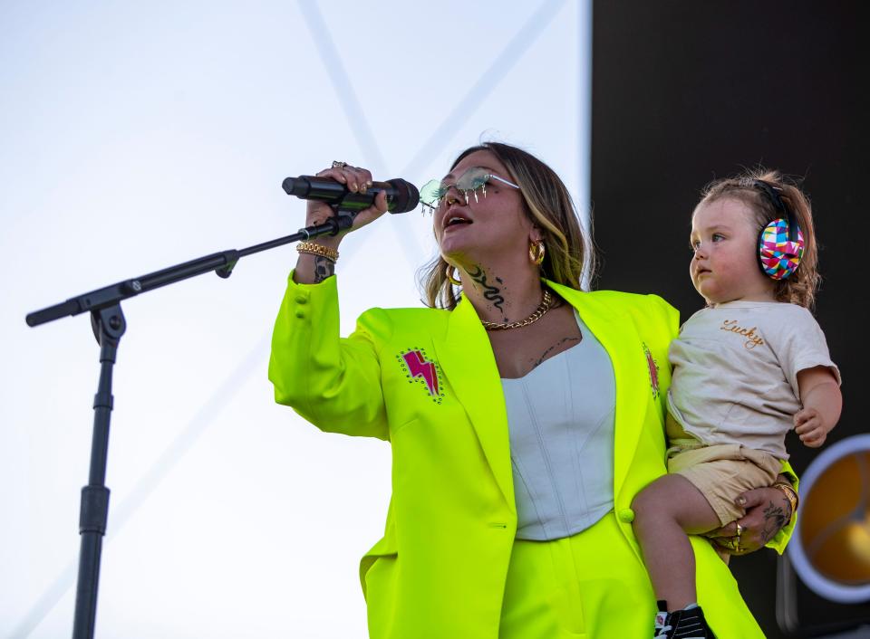 Elle King takes the stage with her son, Lucky Levi Tooker, to start her set on the Mane stage at Stagecoach at the Empire Polo Club in Indio, Calif., Friday, April 28, 2023. 
