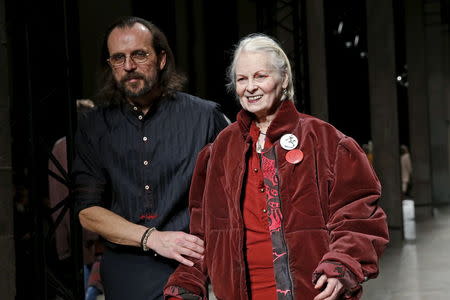 British designer Vivienne Westwood appears next to her husband Andreas Kronthaler at the end of their Fall/Winter 2016/2017 women's ready-to-wear collection show in Paris, France, March 5, 2016. REUTERS/Benoit Tessier
