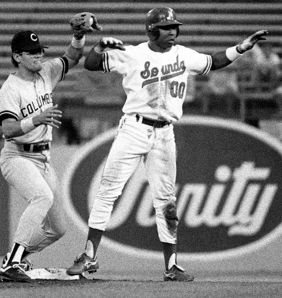 Nashville Sounds first baseman Skeeter Barnes (00), right, lets the umpire know he thinks he was safe after steal a base against Columbus Clippers at Greer Stadium May 31, 1988. The Sounds went on to a 10-1 victory to extend their winning streak to a season-high five games.