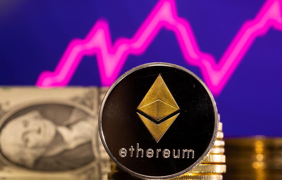 A representations of cryptocurrency Ethereum is seen in front of a stock graph and U.S. dollar in this illustration taken, January 24, 2022. REUTERS/Dado Ruvic/Illustration